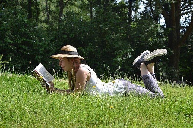 girl reading in park